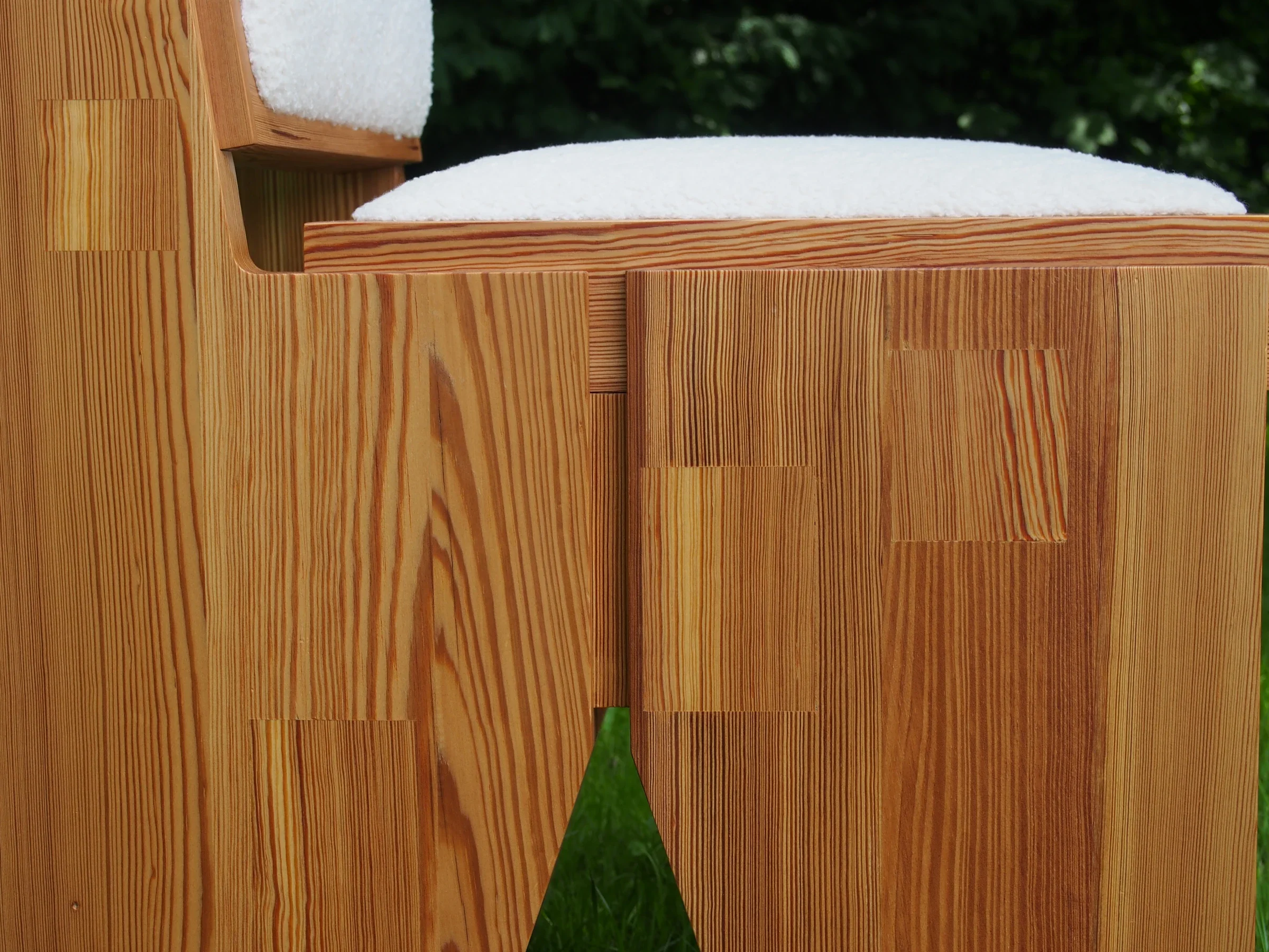Detail of the patchwork pine panels below the seat