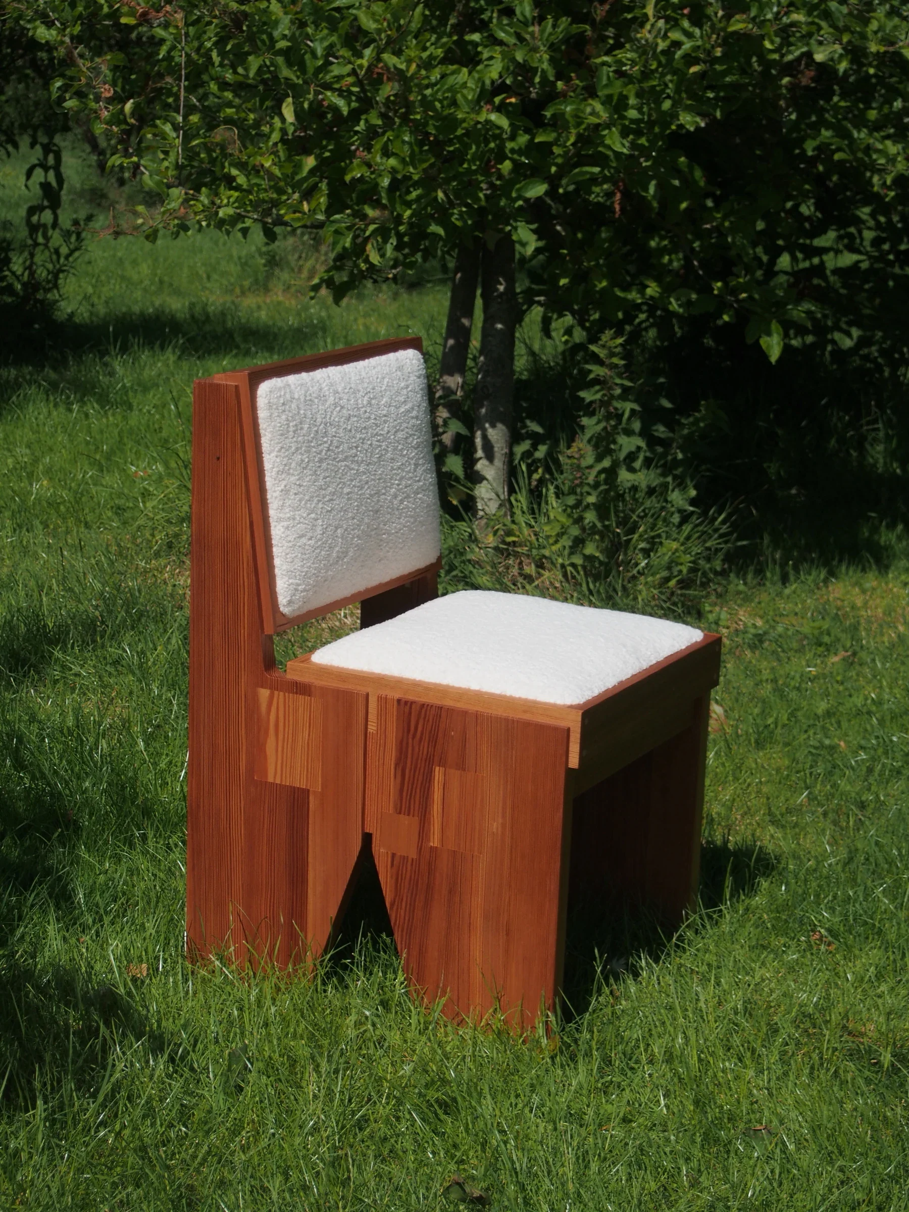 Full Patchwork Chair with white upholstery on the lawn